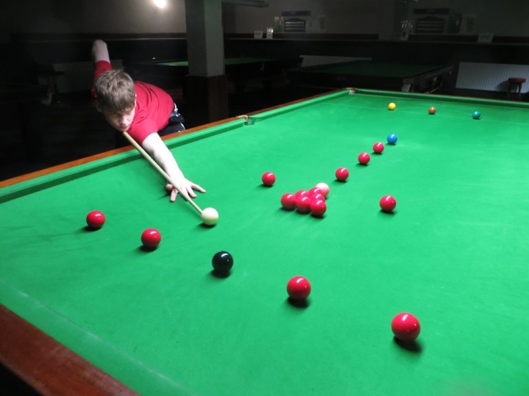 Young man playing snooker